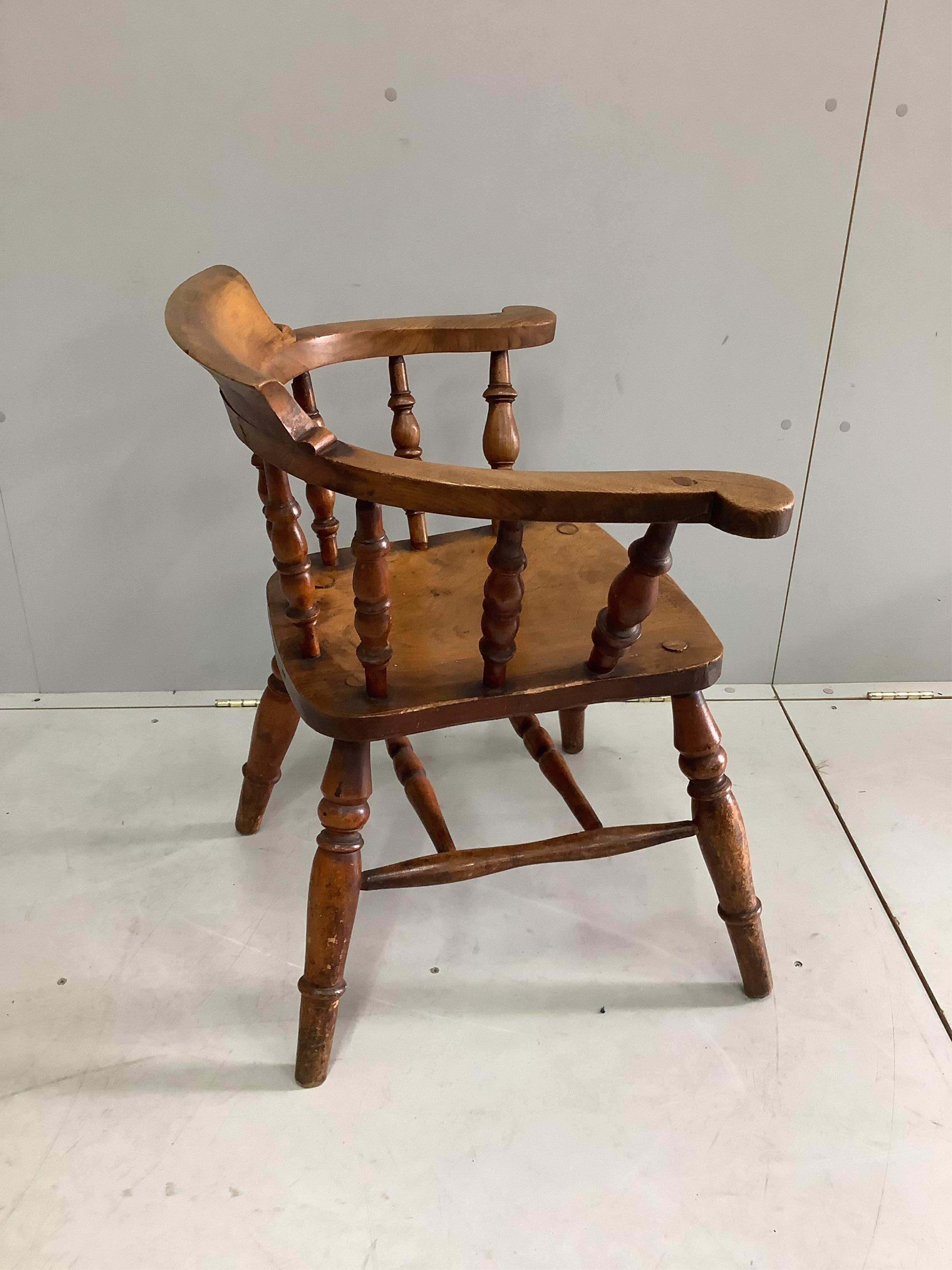 A Victorian elm and beech smoker's bow chair, width 65cm, depth 46cm, height 77cm. Condition - fair